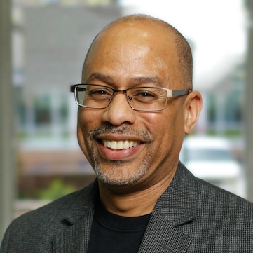 David W. Brown smiles at the camera.