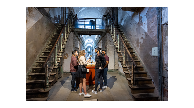 group of people taking the audio tour in Cellblock 7