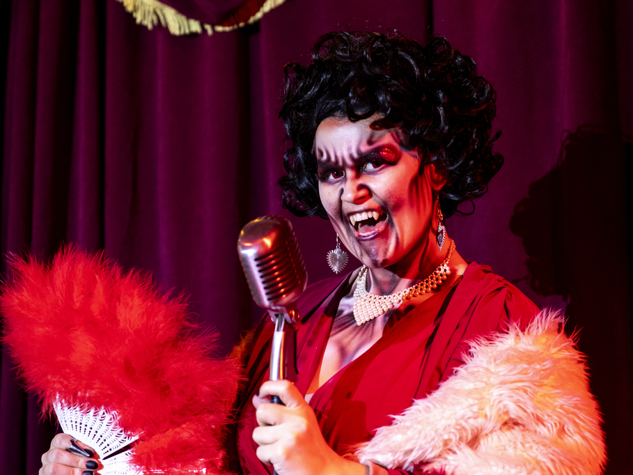 A photo of a vampire chanteuse at The Bloodline Lounge